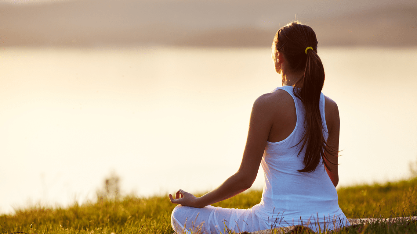 A Person Meditating in Nature